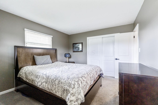 carpeted bedroom with a closet