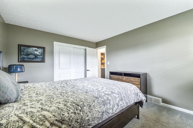 carpeted bedroom with a closet