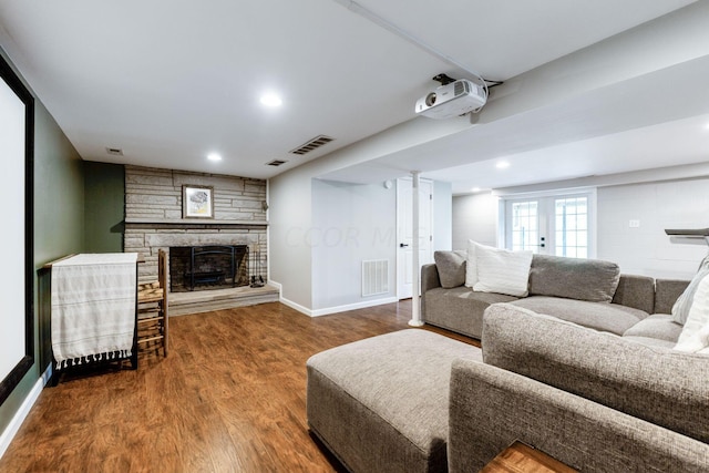 living room featuring hardwood / wood-style flooring and a fireplace