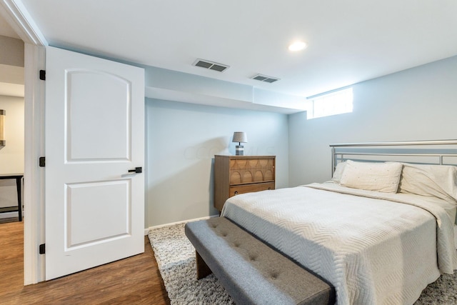 bedroom featuring dark hardwood / wood-style floors