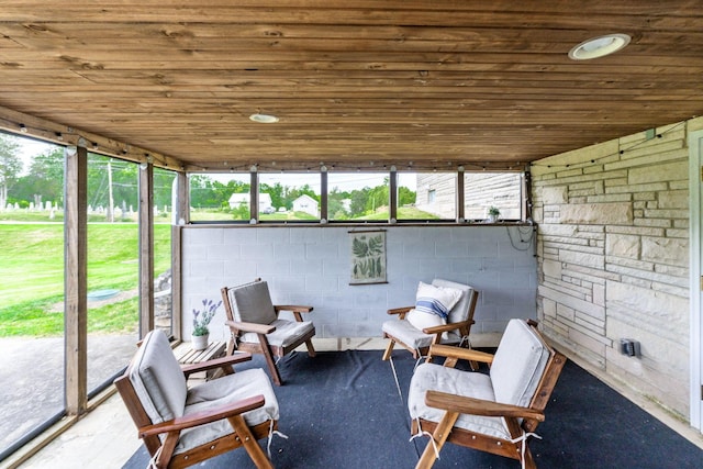 sunroom / solarium with wood ceiling and a healthy amount of sunlight