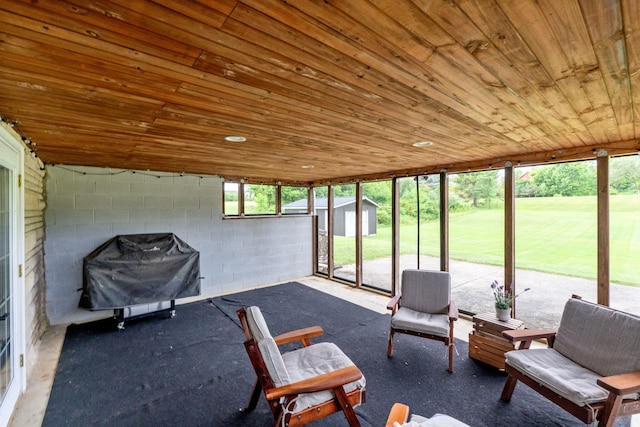 unfurnished sunroom with wood ceiling