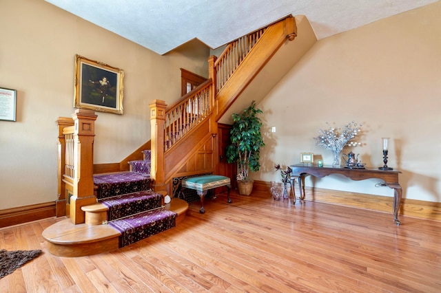 interior space featuring a textured ceiling and light hardwood / wood-style flooring