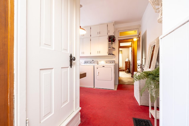 laundry area featuring washer and clothes dryer and carpet floors