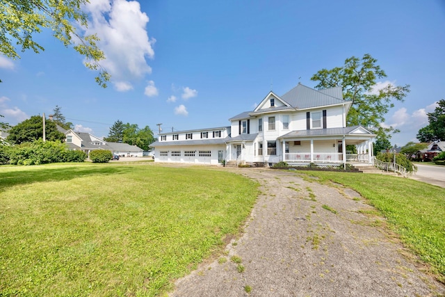 view of front of house featuring a front yard and a porch