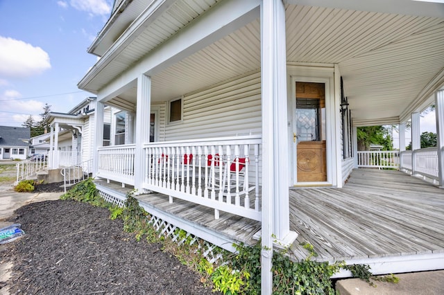 wooden terrace featuring a porch