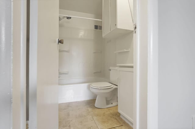 bathroom with tile patterned floors, shower / bathing tub combination, and toilet