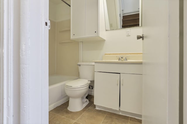 bathroom featuring tile patterned flooring, vanity, and toilet