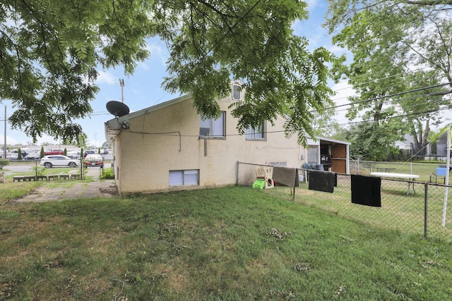 view of property exterior with a yard