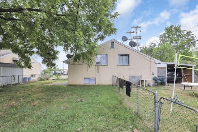 rear view of property featuring a yard