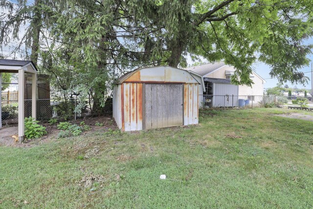 view of outdoor structure with a lawn