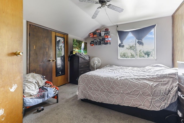 bedroom featuring ceiling fan, carpet, and vaulted ceiling