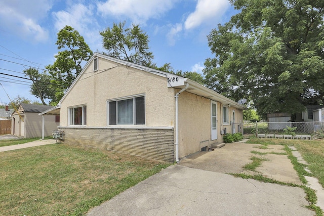 view of home's exterior with a lawn