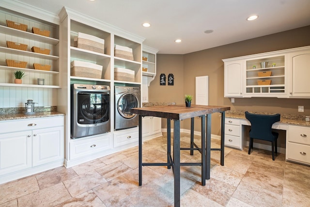 clothes washing area with cabinets, separate washer and dryer, and ornamental molding