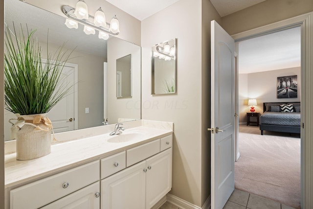 bathroom featuring tile patterned flooring and vanity