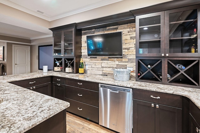 kitchen with dishwasher, light stone countertops, ornamental molding, and light hardwood / wood-style flooring