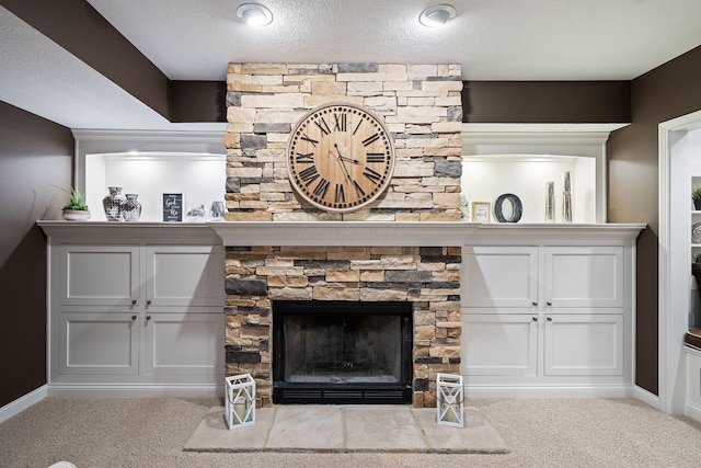 details with carpet flooring, a fireplace, and a textured ceiling