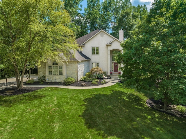 view of front of home with a front lawn