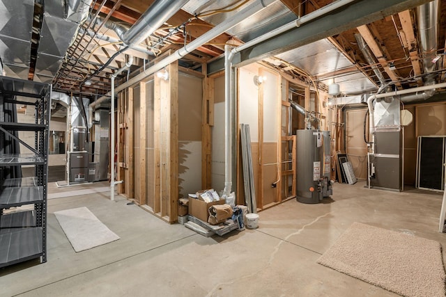 basement featuring heating unit and water heater