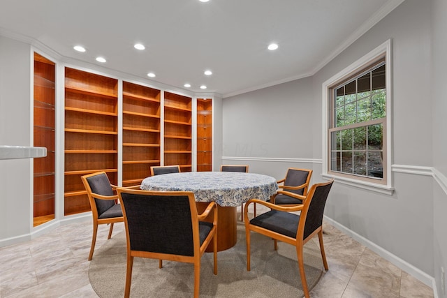 tiled dining space featuring crown molding