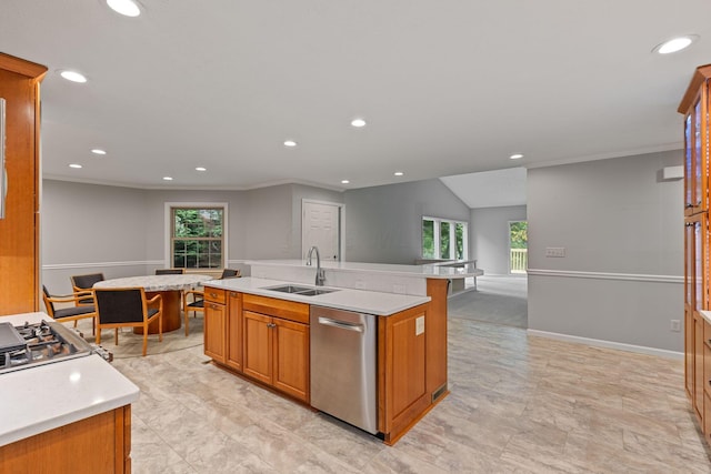 kitchen featuring ornamental molding, sink, dishwasher, lofted ceiling, and an island with sink