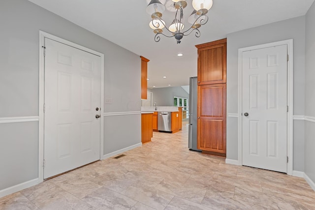 interior space with sink and a notable chandelier