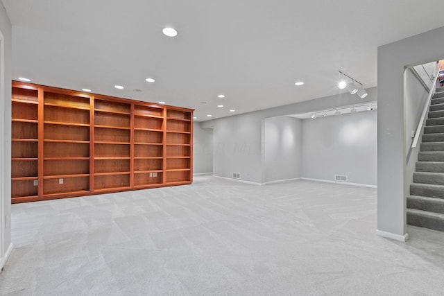 basement with light colored carpet