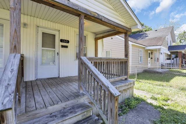 view of exterior entry with covered porch