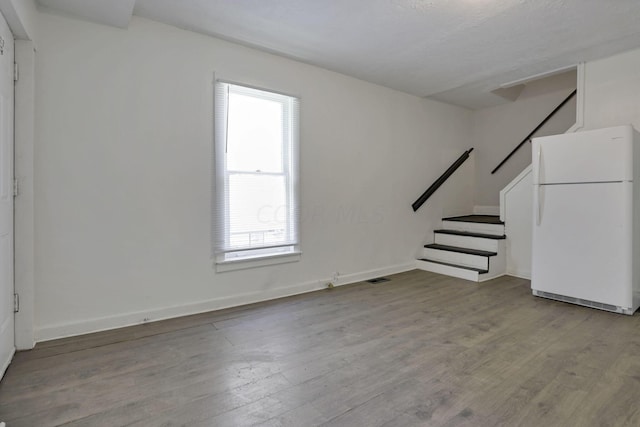 unfurnished living room with light wood-type flooring