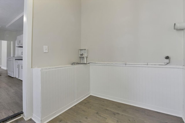 laundry area with hardwood / wood-style flooring