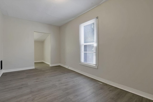 empty room with hardwood / wood-style floors