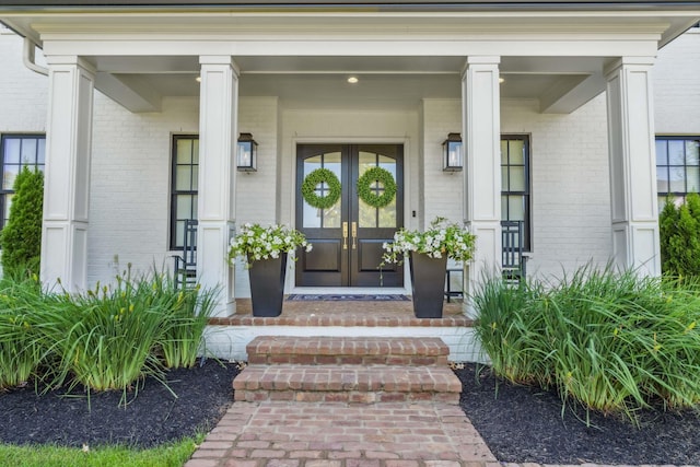 view of exterior entry featuring french doors