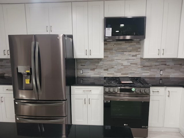 kitchen with white cabinets, ventilation hood, stainless steel appliances, and tasteful backsplash