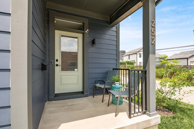 property entrance featuring a porch