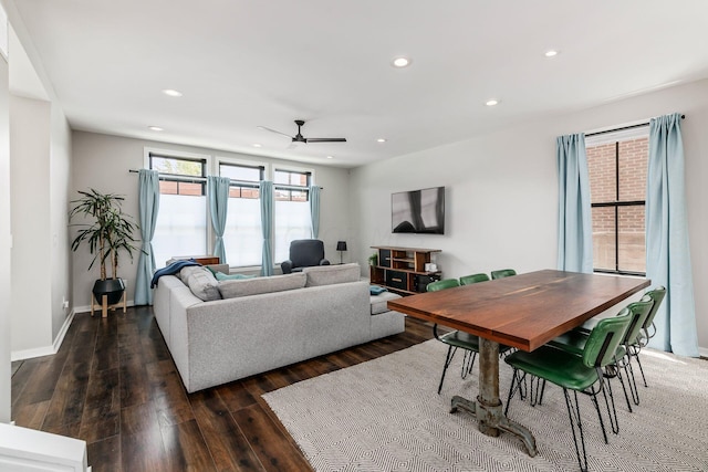 living room with ceiling fan and dark wood-type flooring