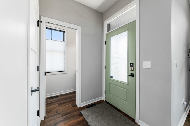 doorway featuring plenty of natural light and dark hardwood / wood-style floors