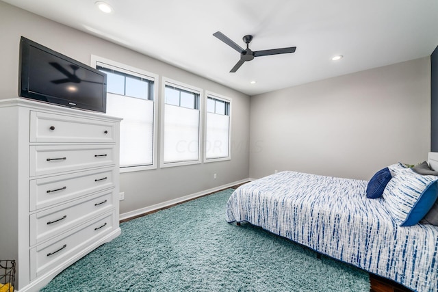 carpeted bedroom featuring ceiling fan