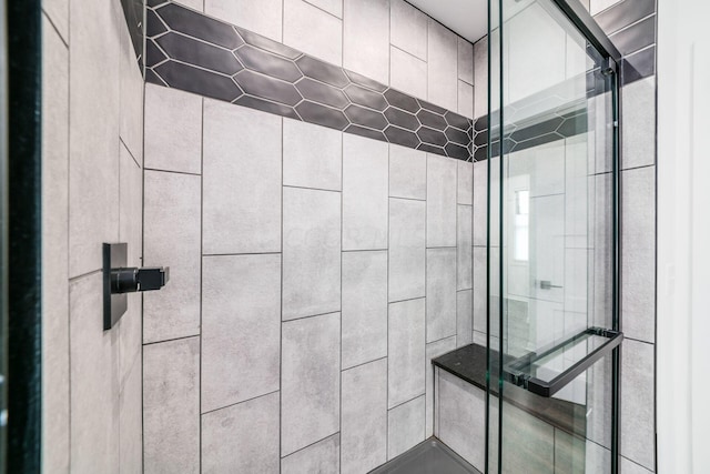 bathroom featuring tiled shower