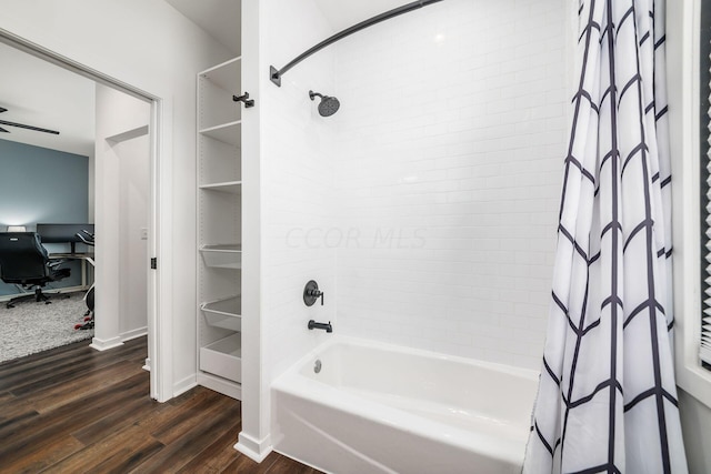 bathroom with wood-type flooring and shower / tub combo with curtain