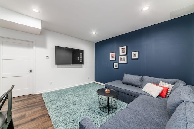 living room with dark hardwood / wood-style flooring