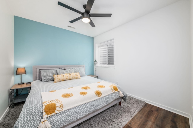 bedroom featuring ceiling fan and dark hardwood / wood-style flooring