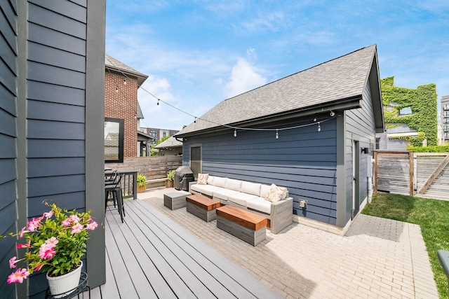 wooden terrace featuring outdoor lounge area and area for grilling