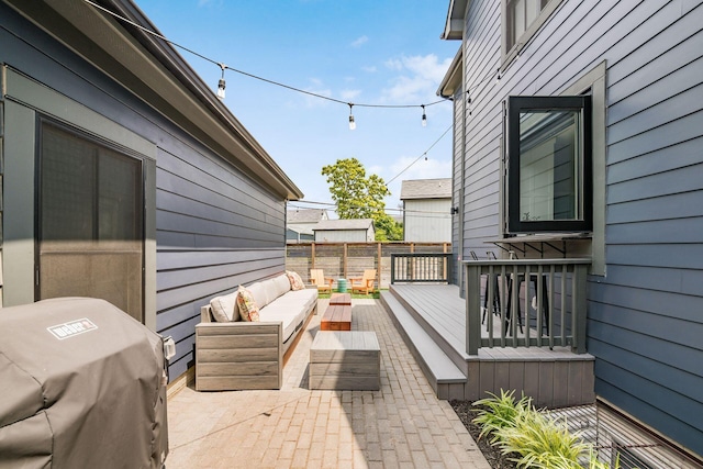 view of patio / terrace with an outdoor living space and area for grilling