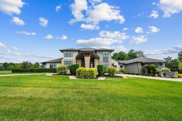 view of front of home with a front lawn