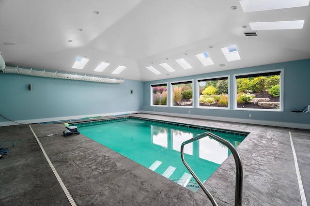 view of swimming pool with a skylight