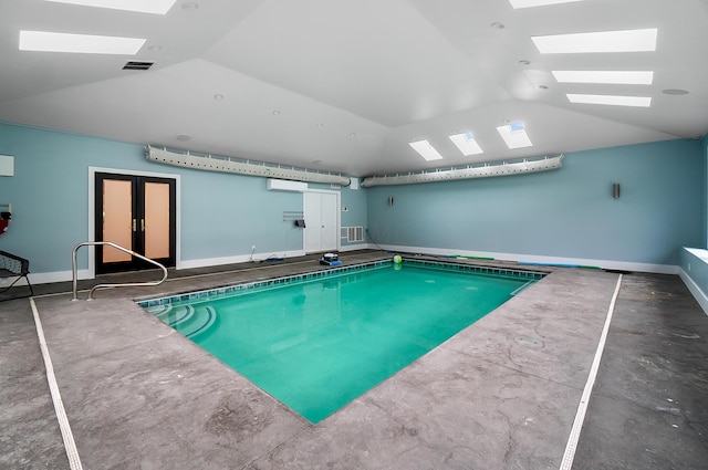 view of swimming pool with a skylight