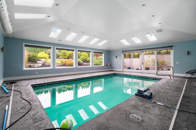 view of swimming pool featuring a skylight