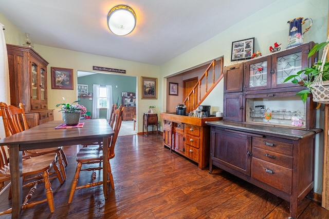 dining room with dark wood-type flooring