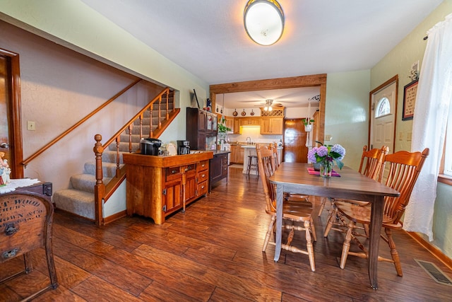 dining room featuring dark hardwood / wood-style flooring and sink