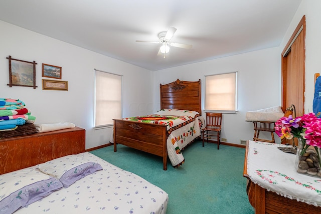 bedroom featuring ceiling fan, dark carpet, and a closet